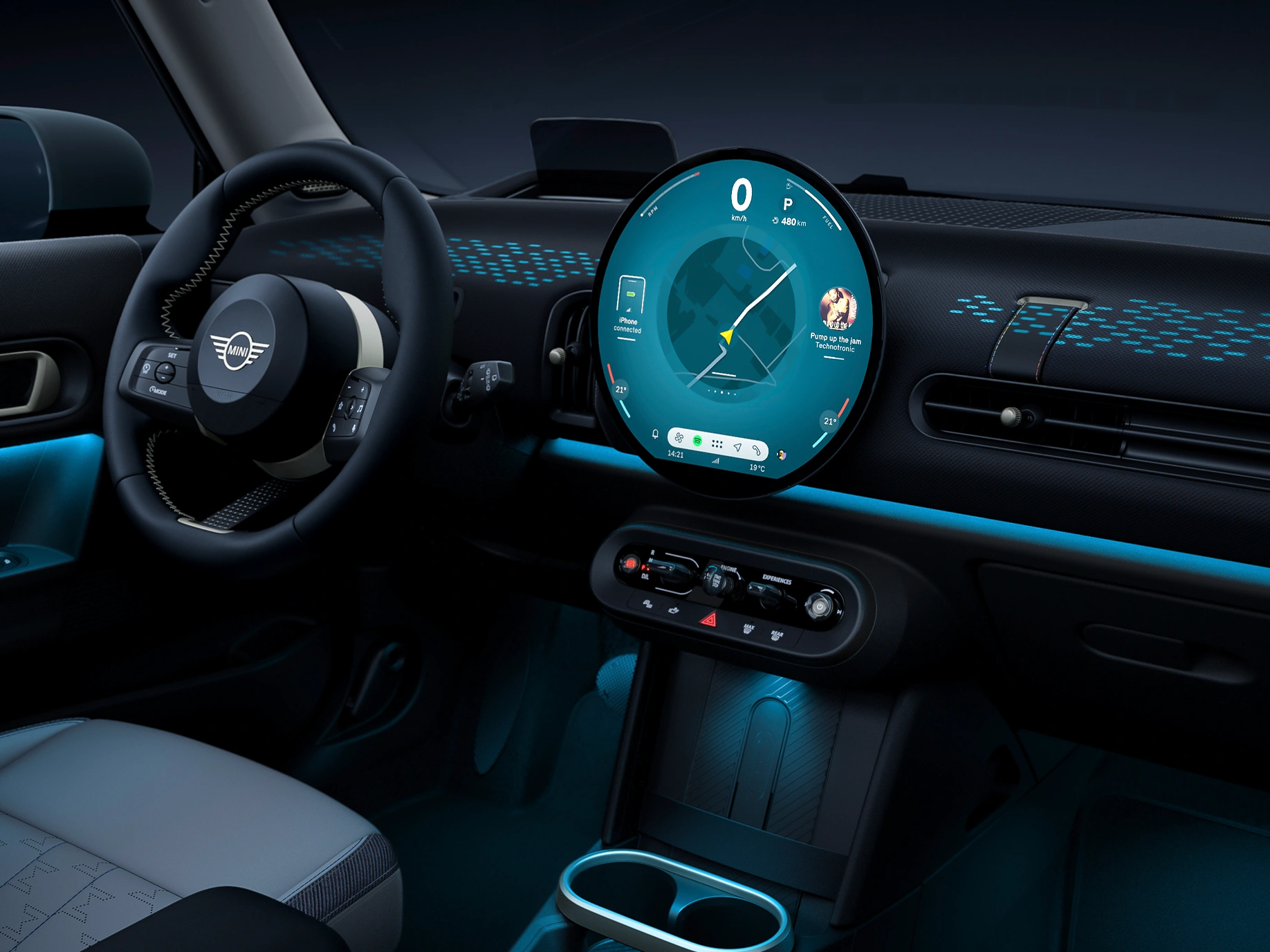 View of the interior of the MINI Cooper with ambient light in blue.
