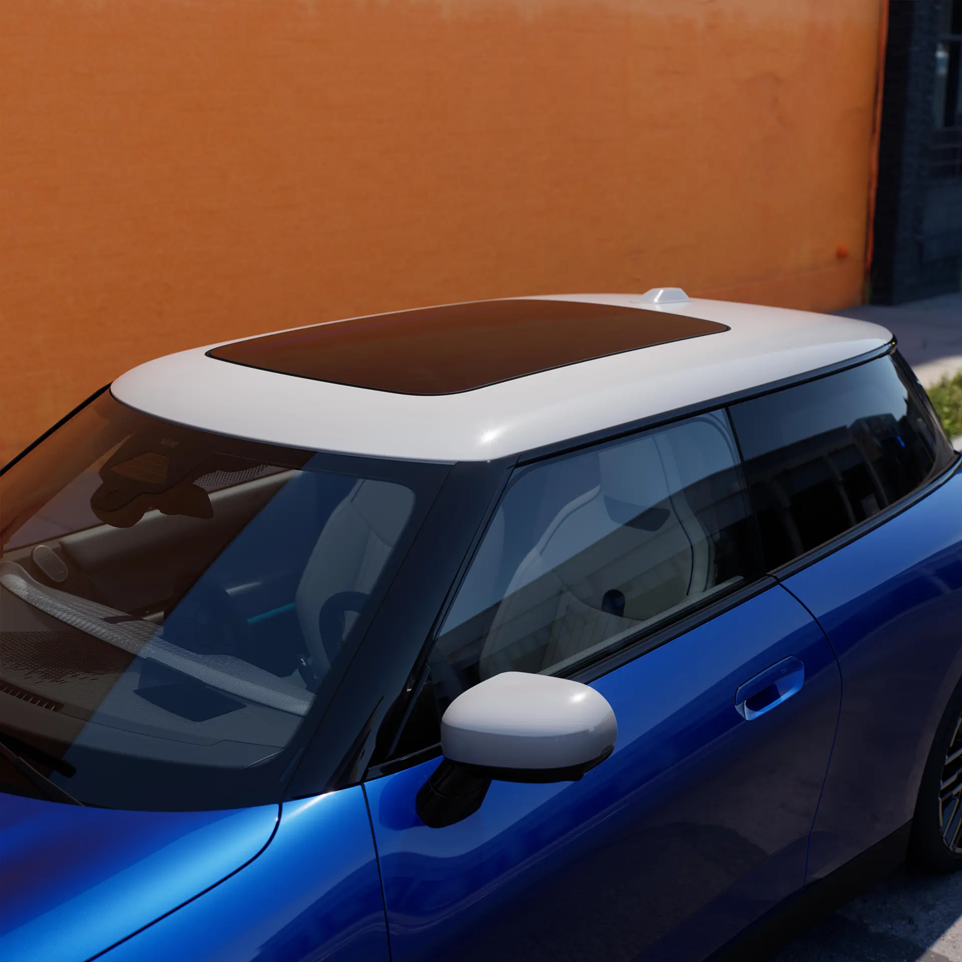 Top view of all-electric MINI Cooper in blue with with contrast roof and big glass roof