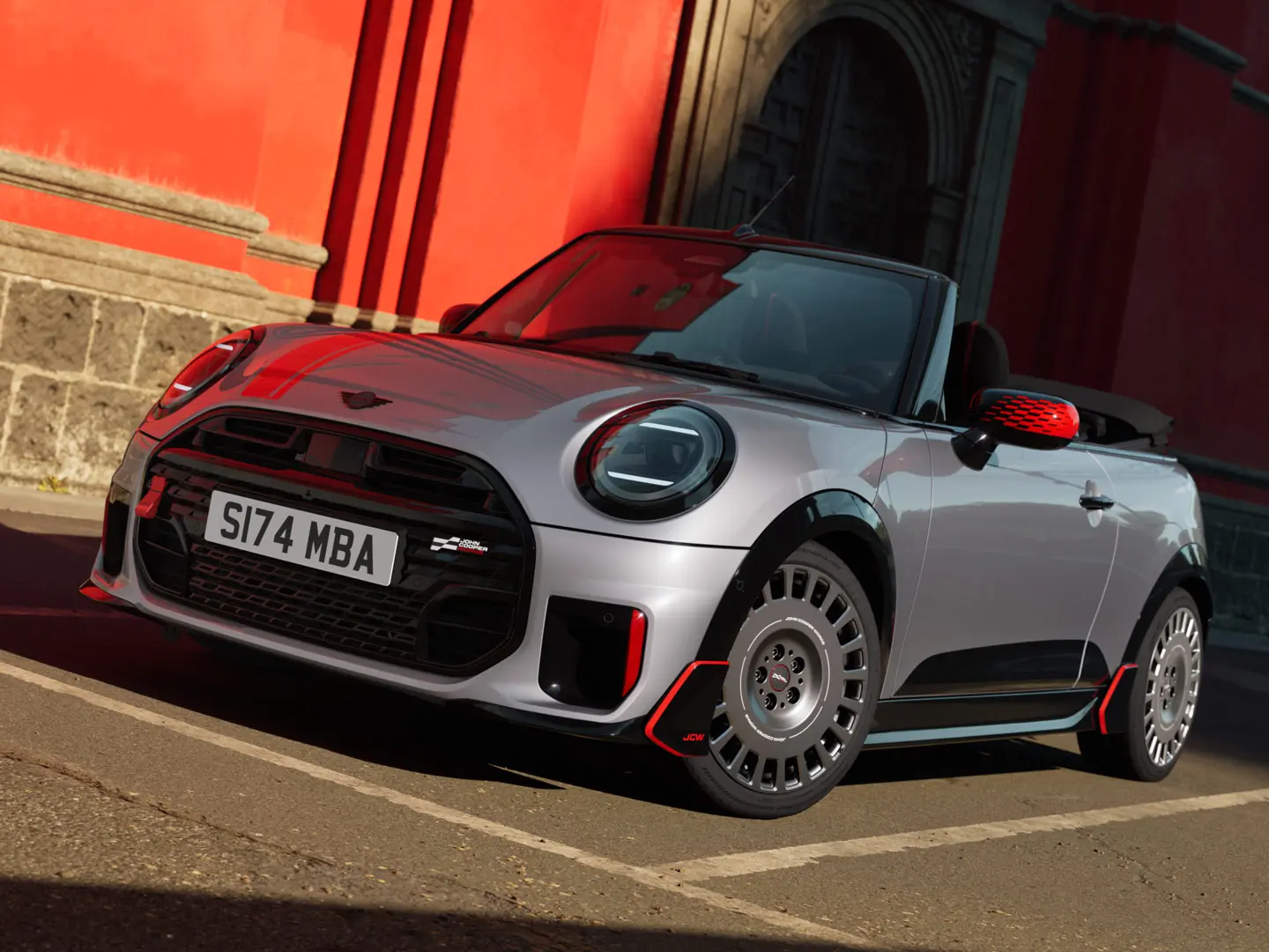 MINI Convertible in Silver boasting sporty JCW styling products including MINI JCW mirror caps, sport stripes and winglet.