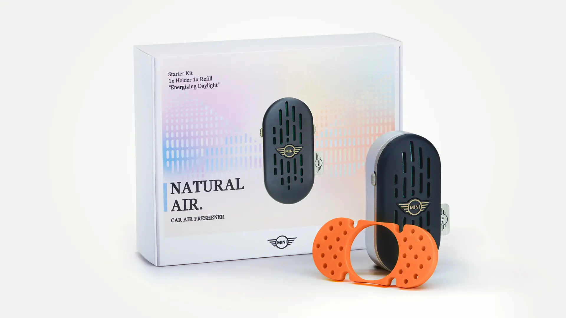 Pack shot of the MINI Natural Air car air freshener starter set, which includes the scent holder and stick.