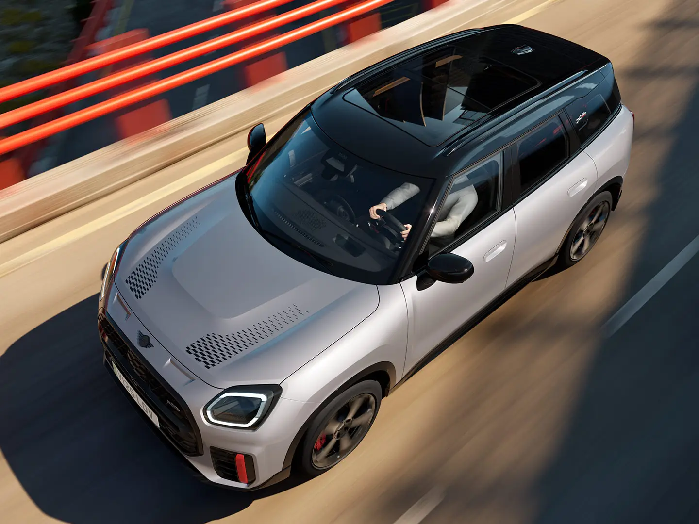 MINI Countryman John Cooper Works in Melting Silver with black roof showing standard equipment – front side view.