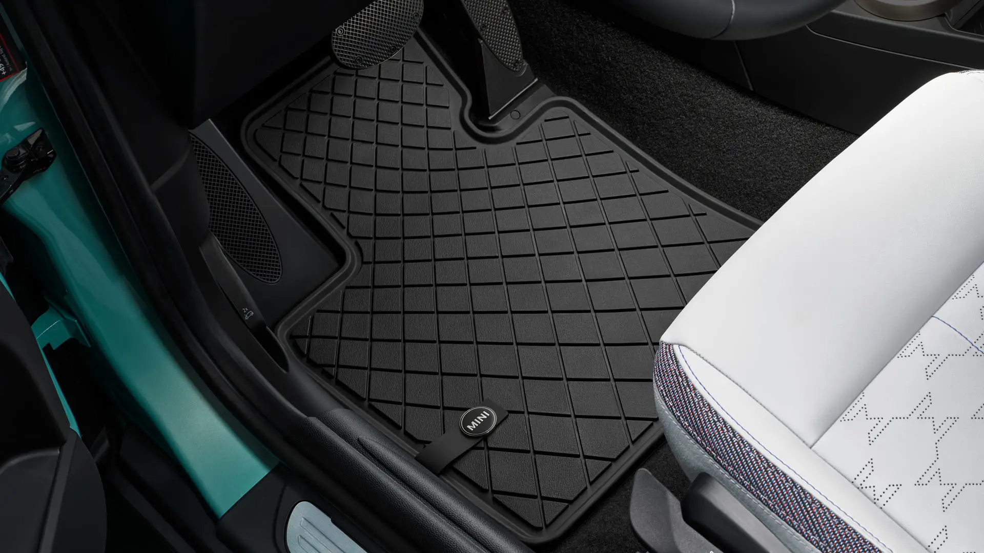 Standard MINI floor mat in footwell.
